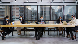 iStock-masked people in boardroom.jpg