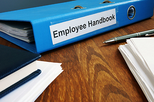 Employee Handbook with Glasses